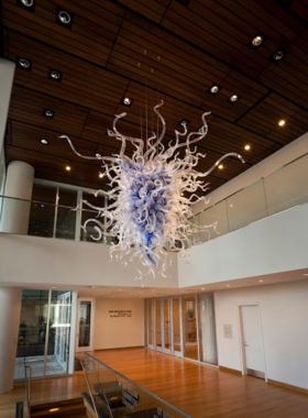 Mint-Museum-Uptown-Art-Collection-Visitors This image shows that art enthusiasts are exploring the Mint Museum Uptown, where they are admiring an extensive collection of contemporary art and works from renowned American artists.