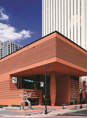 Bechtler-Museum-Modern-Art-Exhibition-Visitors This image shows that art lovers are admiring modern art exhibitions at the Bechtler Museum of Modern Art, where they are discovering masterpieces from prominent 20th-century artists in a contemporary gallery space.