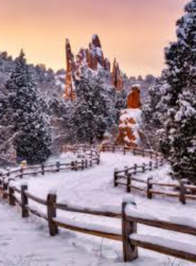 garden-of-the-gods-rock-formations.jpg This image shows the breathtaking red rock formations at Garden of the Gods, with towering sandstone rocks set against a bright blue sky and the distant mountains.