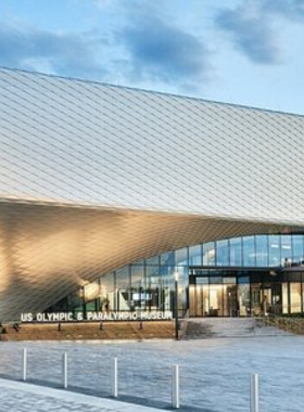 us-olympic-paralympic-museum-exhibits.jpg This image shows an interactive exhibit at the U.S. Olympic & Paralympic Museum, with displays honoring Olympic athletes and Paralympic heroes.