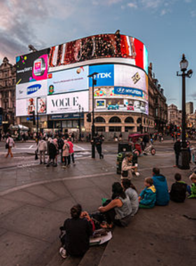 Piccadilly Circus at Night This image shows Piccadilly Circus with its famous neon lights and lively evening crowd.