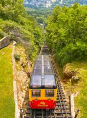 Lookout Mountain Incline Railway his image shows the Lookout Mountain Incline Railway, one of the world’s steepest railways. Visitors can see a train car ascending the mountain, offering scenic city views.