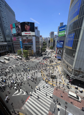 shibuya-crossing-busy-pedestrian-scramble.jpg This image shows the iconic Shibuya Crossing in Tokyo, with hundreds of pedestrians crossing from all directions. The large digital billboards light up the busy intersection, while the surrounding buildings showcase the vibrant and fast-paced energy of Tokyo, especially during rush hour.
