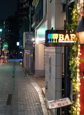roppongi-nightlife-dining-bars.jpg This image shows the bustling nightlife scene in Roppongi, Tokyo, with neon lights, lively bars, and restaurants filled with both locals and international visitors. The area is known for its dynamic atmosphere, offering a wide range of entertainment options, including late-night dining and music venues.