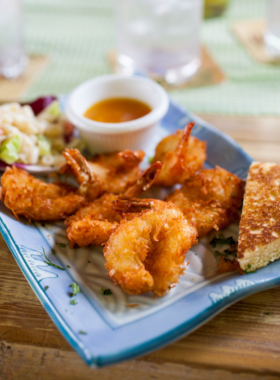 local-cuisine-aruba-dishes.jpg This image shows that Aruba’s local cuisine features a mix of Caribbean, Latin, and Dutch influences, with dishes like "keshi yena" and fresh seafood, offering visitors a taste of the island’s diverse flavors.