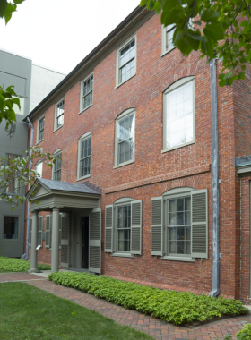 13. Maine State Pier This image shows the Maine State Pier at sunset, with visitors walking along the pier, enjoying the picturesque views of the harbor and Portland skyline.