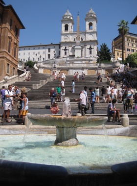 Climb the Spanish Steps This image shows the Spanish Steps at sunset, a famous gathering spot with beautiful views and lively surroundings.