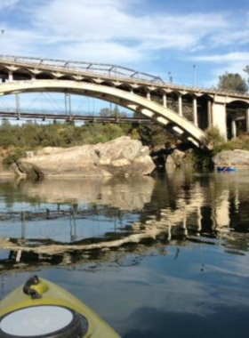 American-River-Parkway-Trail This image shows a peaceful trail along the American River Parkway, perfect for hiking or biking. The natural beauty of the area offers outdoor enthusiasts a chance to enjoy the tranquility of the river and surrounding wildlife.