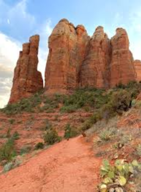 Cathedral-Rock-Hike-Sedona This image shows the challenging Cathedral Rock hike in Sedona, with rocky terrain leading up to a summit that offers panoramic views of the stunning red rock landscape.