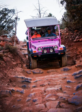 Pink-Jeep-Tour-Sedona This image shows a thrilling Pink Jeep Tour in Sedona, where adventure seekers explore rugged terrains, hidden canyons, and majestic red rock landscapes in a sturdy off-road vehicle.