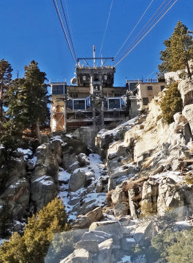 Palm Springs Aerial Tramway This image shows the Palm Springs Aerial Tramway with its iconic cable cars gliding over the Coachella Valley, offering breathtaking views of the desert landscape below.