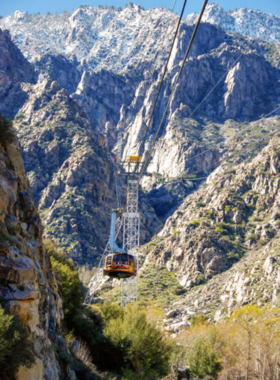 San Jacinto Peak This image shows the summit of San Jacinto Peak, offering panoramic views of Palm Springs and the surrounding desert landscape, with hikers enjoying the breathtaking scenery.