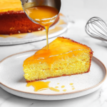 serving cranberry orange cake with warm butter sauce drizzle