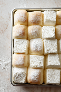 Preheat the oven to 300°F (150°C). Cut the bread into large cubes and transfer to a baking sheet. Toast in the oven for about 5 minutes.