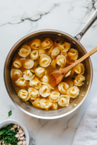 Adding Chicken Broth Bringing to a Boil