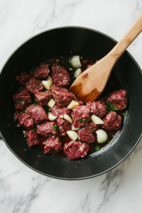 Brown the ground chuck and garlic