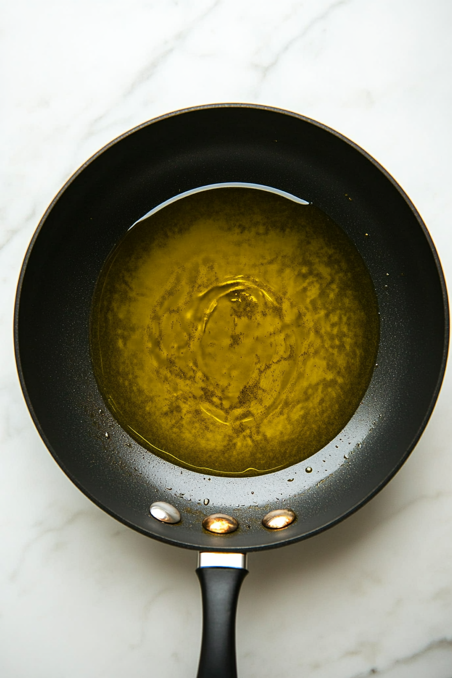 Heat olive oil in a large skillet over medium heat.