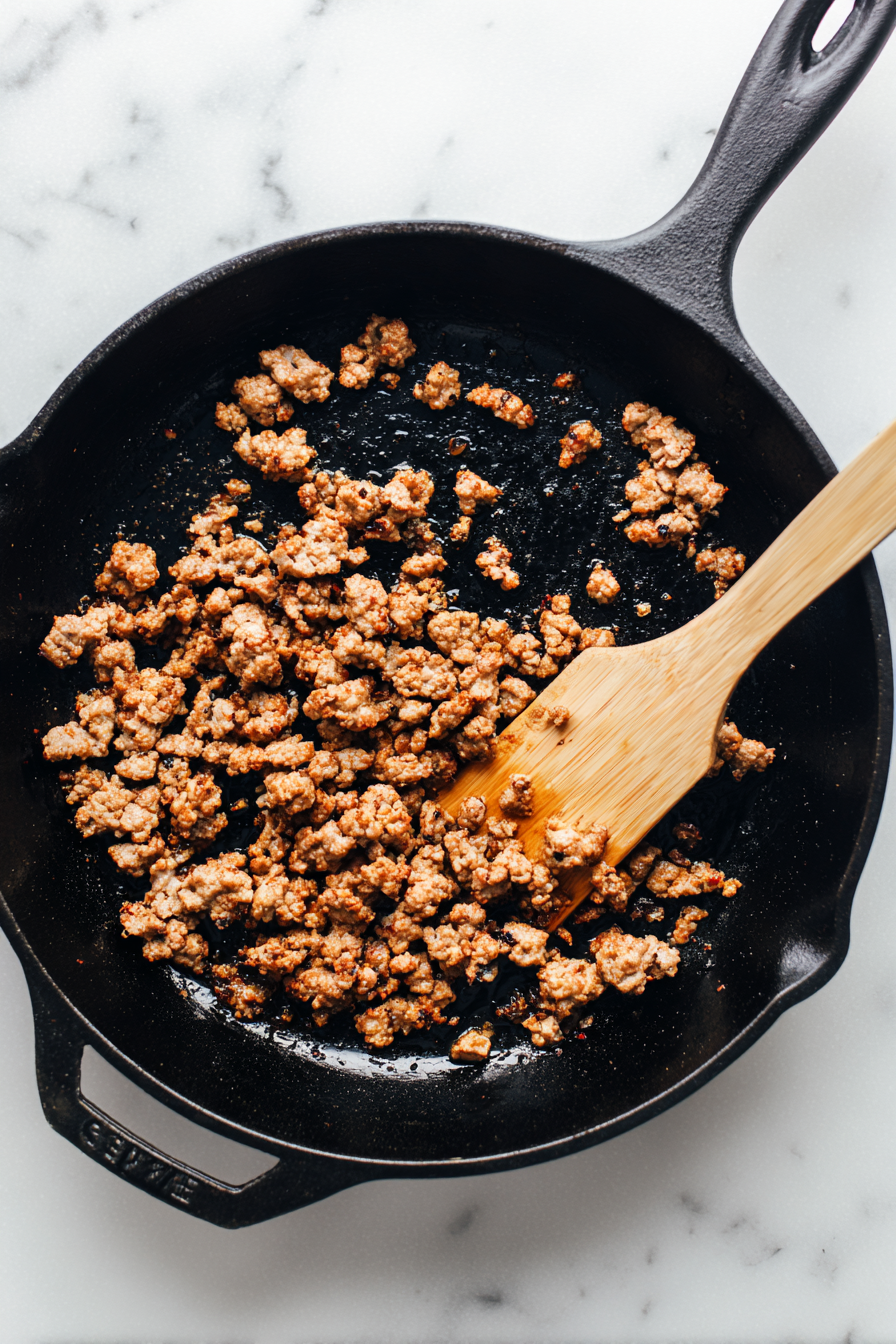 In the same pan, cook ground pork sausage until browned. Break it up while cooking.