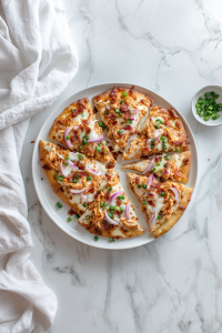 Quick & Easy Buffalo Chicken Flatbread Recipe! Slice and serve hot with extra ranch or hot sauce if you’d like!
