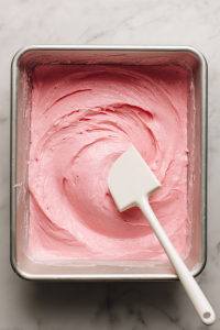 Stir in the vanilla extract, then pour batter evenly into the pans.