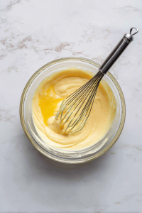 Add lightly beaten eggs gradually, mixing on low until just incorporated. Don’t overmix.