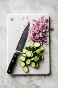 Chop 4 cups of cucumber and 1 small red onion.