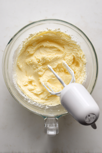 Cream butter and sugar until light and fluffy; add eggs and vanilla.