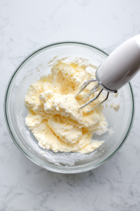 In a large bowl, cream the butter and sugar until light and fluffy.