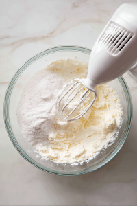 In another bowl, beat cream cheese, sugar, and vanilla until smooth.