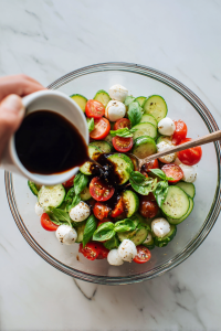 Drizzle the balsamic vinaigrette over the salad.