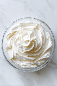 While they cool, beat together butter, cream cheese, vanilla, and powdered sugar to make the frosting.