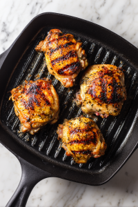 Heat a grill pan over medium-high heat and cook the chicken for 6–7 minutes per side until golden and cooked through.