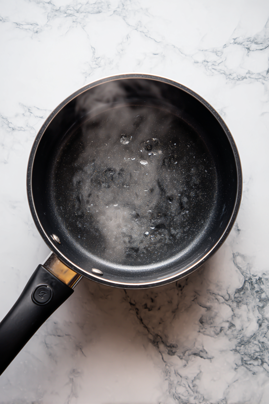 Remove from heat and let the glaze cool slightly.