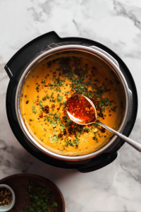 Pour the hot tadka over the cooked dal and mix well.