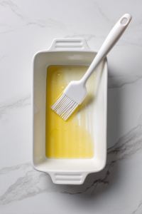 Preheat oven to 350°F (175°C) and grease a 9x5-inch loaf pan.