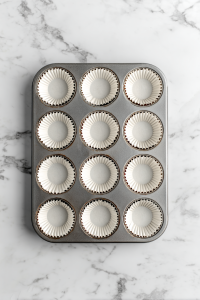 Preheat your oven to 350°F (175°C) and line a cupcake pan with liners.