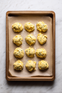 Scoop the batter onto the tray to form small rounds (like buns).