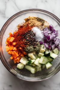 Sprinkle salt, roasted cumin powder, black pepper, and red chilli powder.