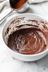 Sift the cocoa powder and gently fold